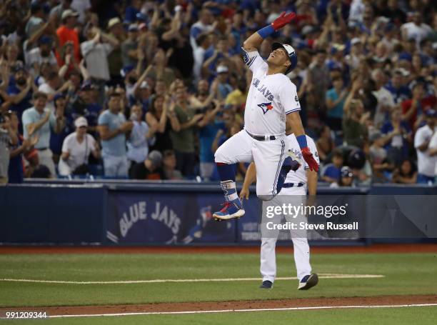 Toronto Blue Jays second baseman Yangervis Solarte celebrates rounding third base after hitting a seventh inning three run homer run to tie the game...