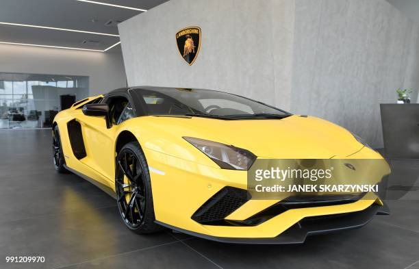 Lamborghini car stands in a car dealer's shop in Warsaw on Jun 15, 2018. - Luxury has become increasingly visible in Poland after a long absence due...