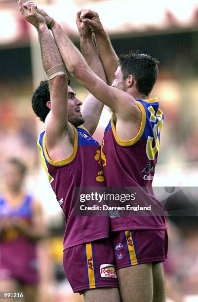 Nigel Lappin and Robert Copeland of Brisbane celebrate kicking a goal against Richmond during the Round 19 AFL match at the Gabba in Brisbane,...