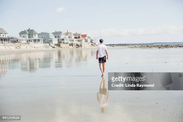 man walking on the beach, maine beach, usa - maine imagens e fotografias de stock