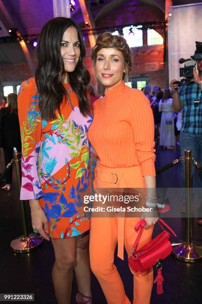 Bettina Zimmermann , Annemarie Carpendale during the Marc Cain Fashion Show Spring/Summer 2019 at WEEC, Westhafen, on July 3, 2018 in Berlin, Germany.