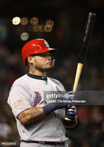 Yadier Molina of the St. Louis Cardinals warms up on deck during the second inning of the MLB game against the Arizona Diamondbacks at Chase Field on...