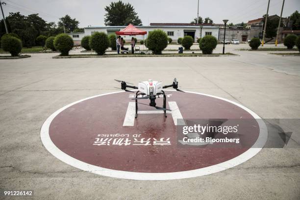 Com Inc. Drone sits during a package delivery demonstration at a launch pad of the company's drone testing site in Xi'an, China, on Tuesday, June 19,...