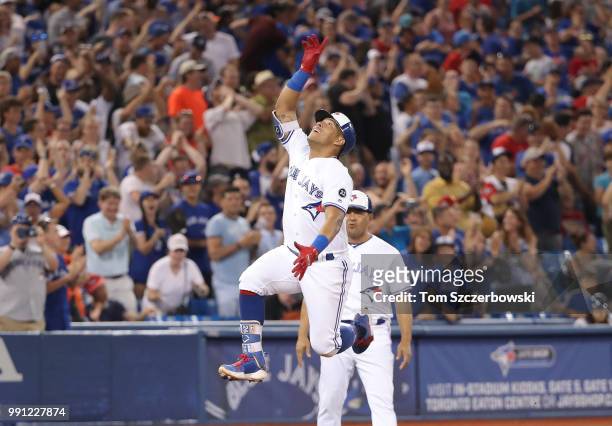 Yangervis Solarte of the Toronto Blue Jays celebrates after hitting a two-run home run in the seventh inning during MLB game action against the New...