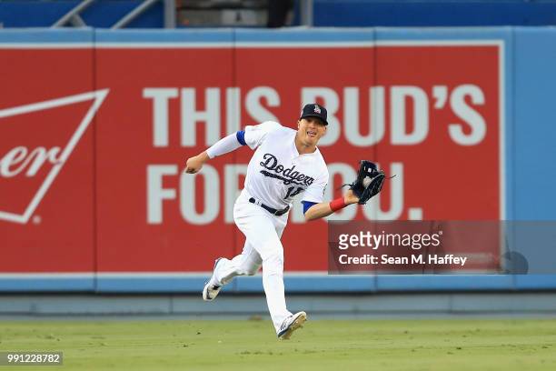 Enrique Hernandez of the Los Angeles Dodgers catches a line drive off the bat of Josh Harrison of the Pittsburgh Pirates during the first inning of a...