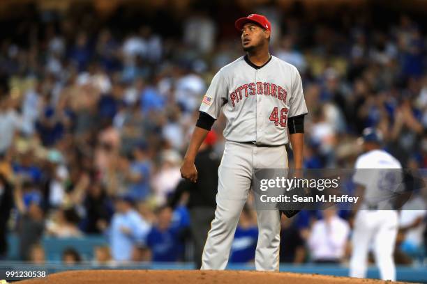 Ivan Nova of the Pittsburgh Pirates looks on after allowing a solo home run to Max Muncy of the Los Angeles Dodgers during third inning of a game at...