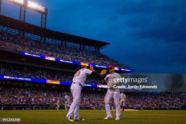 Starting pitcher Antonio Senzatela of the Colorado Rockies congratulates Gerardo Parra at the end of the seventh inning against the San Francisco...