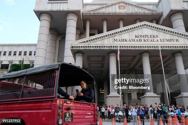 Members of the media gather outside the Kuala Lumpur Courts Complex in Kuala Lumpur, Malaysia, on Wednesday, July 4, 2018. Malaysia's former leader...