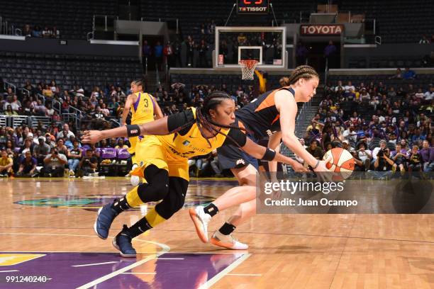 Rachel Banham of the Connecticut Sun handles the ball against Odyssey Sims of the Los Angeles Sparks on July 3, 2018 at STAPLES Center in Los...