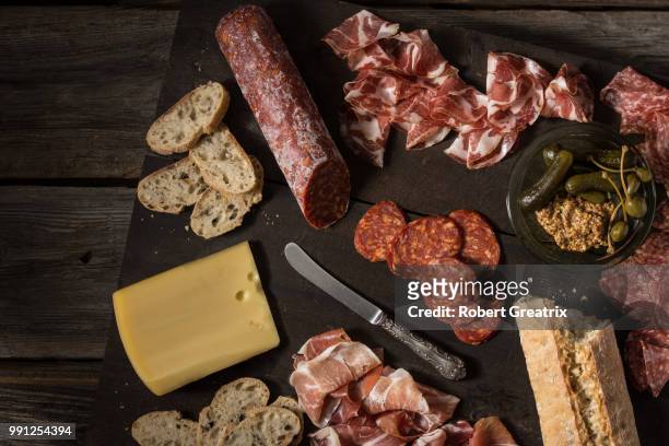 a meat and cheese platter. - prosciutto stock pictures, royalty-free photos & images