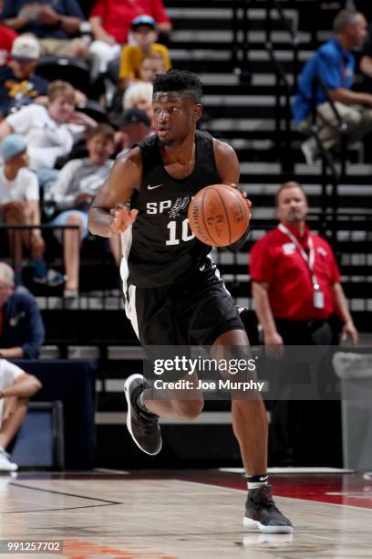 Chimezie Metu of the San Antonio Spurs handles the ball against the Atlanta Hawks during the 2018 Utah Summer League on July 3, 2018 at Vivint Smart...