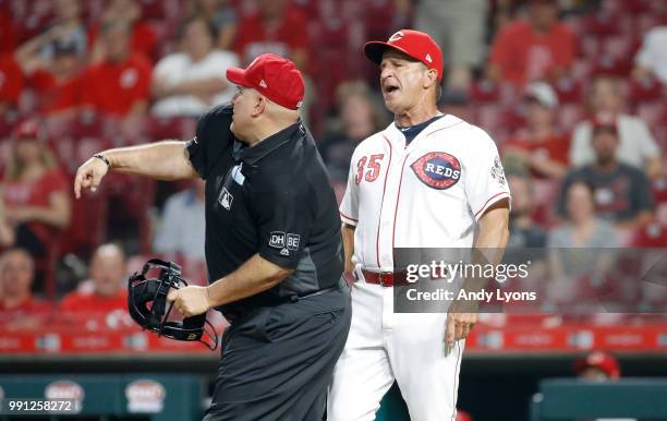 Jim Riggleman the manager of the Cincinnati Reds is ejected by umpire Eric Cooper in the 12th inning against the Chicago White Sox at Great American...