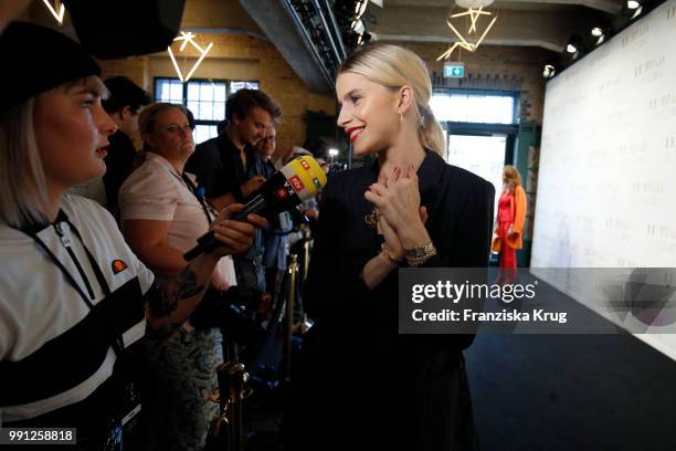 Caro Daur attends the Marc Cain Fashion Show Spring/Summer 2019 at WECC on July 3, 2018 in Berlin, Germany.