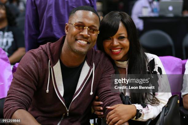 Flex Alexander and music artist Shanice attends the Connecticut Sun vs th Los Angeles Sparks at a WNBA basketball game at Staples Center on July 3,...