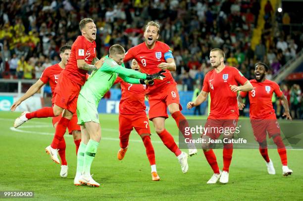 Goalkeeper of England Jordan Pickford is celebrated by teammates Kieran Trippier, Harry Kane, Eric Dier, Danny Rose of England after winning the...