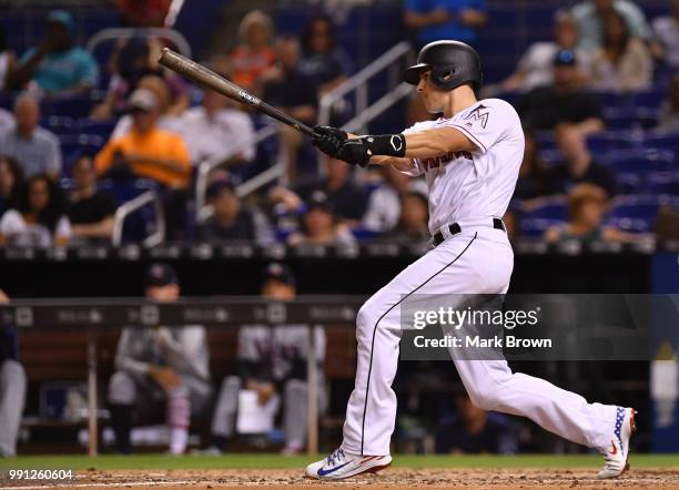 Realmuto of the Miami Marlins doubles in the fifteenth inning against the Tampa Bay Rays at Marlins Park on July 3, 2018 in Miami, Florida.