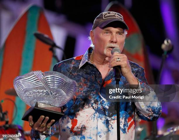 Mike Love of The Beach Boys receives the National Artistic Achievement award at the 2018 A Capitol Fourth rehearsals at U.S. Capitol, West Lawn on...