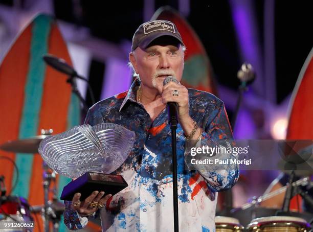 Mike Love of The Beach Boys receives the National Artistic Achievement award at the 2018 A Capitol Fourth rehearsals at U.S. Capitol, West Lawn on...