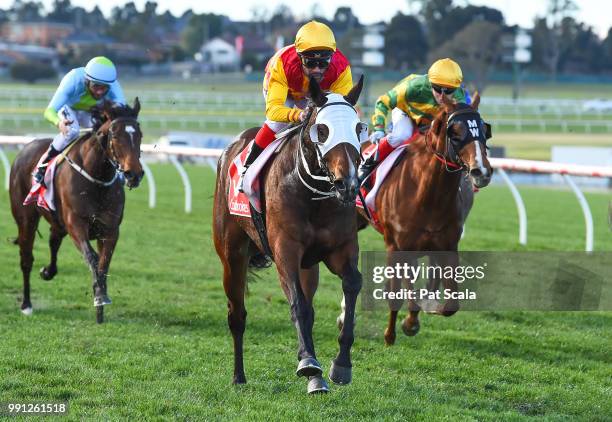 Whyouask ridden by Michael Walker wins the Ladbrokes Handicap Fillies and Mares BM70 Handicap at Ladbrokes Park Hillside Racecourse on July 04, 2018...