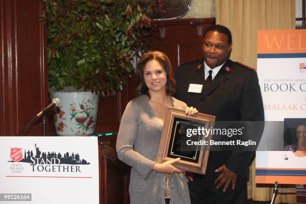 Personality Soledad O'Brien receives and award from Captain Travis B. Lock of the Salvation Army during the Salvation Army's Book Club Luncheon...