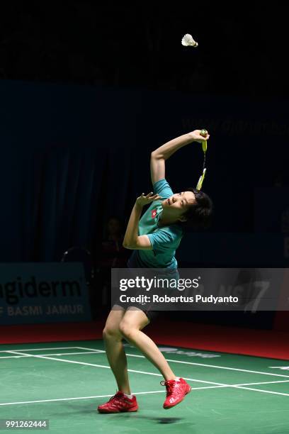 Cheung Ngan Yi of Hong Kong competes against He Bingjiao of China during the Women's Singles Round 1 match on day one of the Blibli Indonesia Open at...