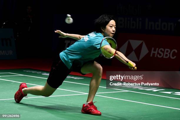 Cheung Ngan Yi of Hong Kong competes against He Bingjiao of China during the Women's Singles Round 1 match on day one of the Blibli Indonesia Open at...