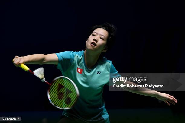 Cheung Ngan Yi of Hong Kong competes against He Bingjiao of China during the Women's Singles Round 1 match on day one of the Blibli Indonesia Open at...