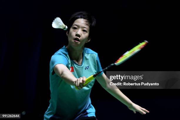 Cheung Ngan Yi of Hong Kong competes against He Bingjiao of China during the Women's Singles Round 1 match on day one of the Blibli Indonesia Open at...