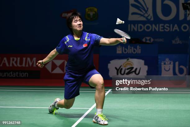 He Bingjiao of China competes against Cheung Ngan Yi of Hong Kong during the Women's Singles Round 1 match on day one of the Blibli Indonesia Open at...