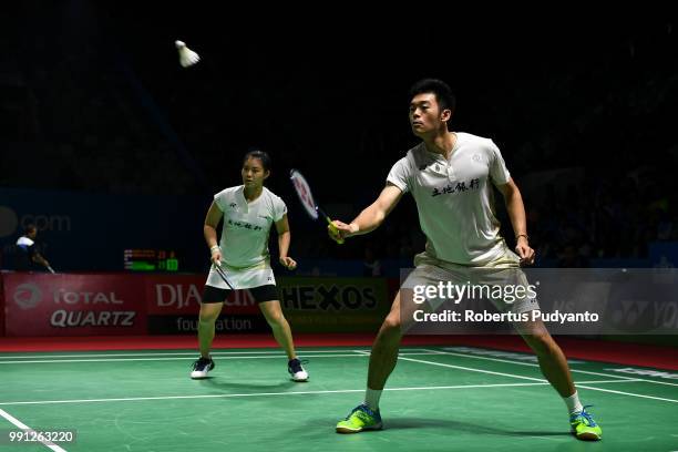 Wang Chi-Lin and Lee Chia Hsin of Chinese Taipei compete against Riky Widianto and Masita Mahmudin of Indonesia during the Mixed Doubles Round 1...