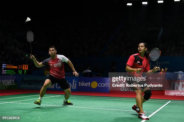 Riky Widianto and Masita Mahmudin of Indonesia compete against Wang Chi-Lin and Lee Chia Hsin of Chinese Taipei during the Mixed Doubles Round 1...