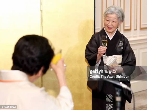 Empress Michiko toast her glass during the 64th Zonta International Convention Closing Reception at Pacifico Yokohama on July 3, 2018 in Yokohama,...