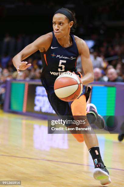 Jasmine Thomas of the Connecticut Sun handles the ball against the Los Angeles Sparks during a WNBA basketball game at Staples Center on July 3, 2018...