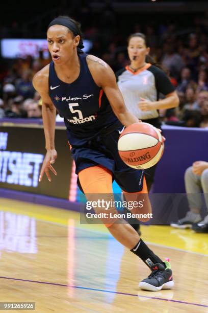 Jasmine Thomas of the Connecticut Sun handles the ball against the Los Angeles Sparks during a WNBA basketball game at Staples Center on July 3, 2018...