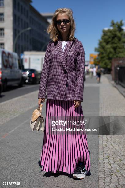 Guest is seen attending Maisonnee Berlin wearing a purple jacket with pink skirt during the Berlin Fashion Week July 2018 on July 3, 2018 in Berlin,...