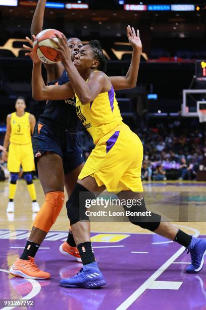 Nneka Ogwumike of the Los Angeles Sparks handles the ball against Chiney Ogwumike of the Connecticut Sun during a WNBA basketball game at Staples...