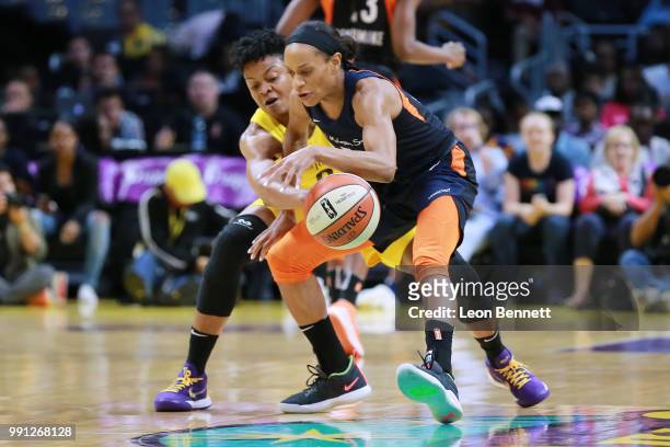 Alana Beard of the Los Angeles Sparks goes for the steall against Jasmine Thomas of the Connecticut Sun during a WNBA basketball game at Staples...