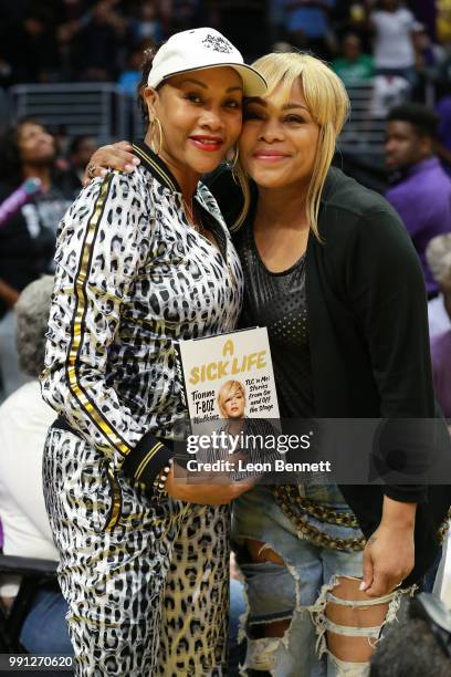 Actress Vivica A. Fox and Tionne "T-Boz" Watkins attend the Connecticut Sun vs the Los Angeles Sparks during a WNBA basketball game at Staples Center...