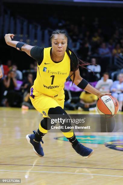 Odyssey Sims of the Los Angeles Sparks handles the ball against the Connecticut Sun during a WNBA basketball game at Staples Center on July 3, 2018...