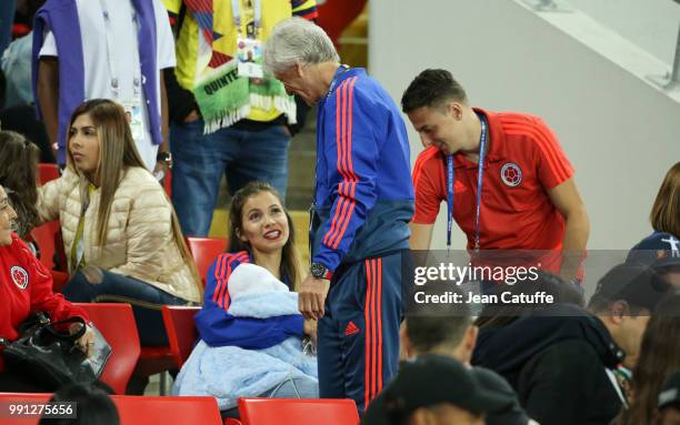 Coach of Colombia Jose Pekerman talks to Santiago Arias of Colombia and his wife Karin Jimenez when the players of Colombia join their families in...