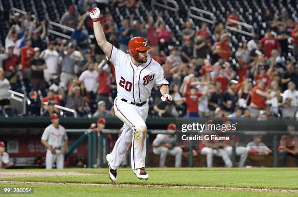 Daniel Murphy of the Washington Nationals celebrates after driving in the game winning run with a single in the eighth inning against the...