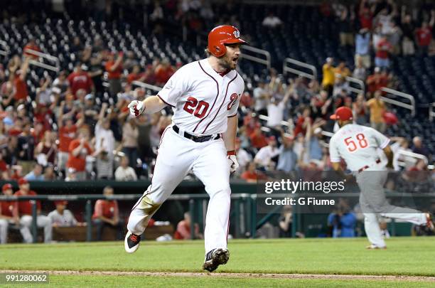 Daniel Murphy of the Washington Nationals celebrates after driving in the game winning run with a single in the eighth inning against the...