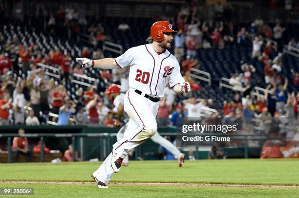 Daniel Murphy of the Washington Nationals celebrates after driving in the game winning run with a single in the eighth inning against the...