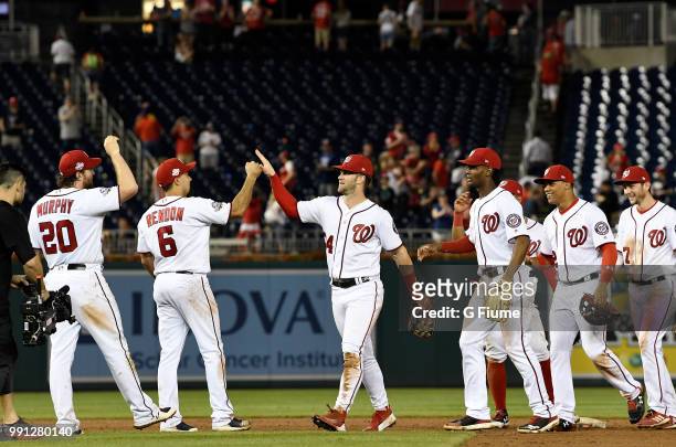 The Washington Nationals celebrate after a 8-6 victory against the Philadelphia Phillies at Nationals Park on June 24, 2018 in Washington, DC.