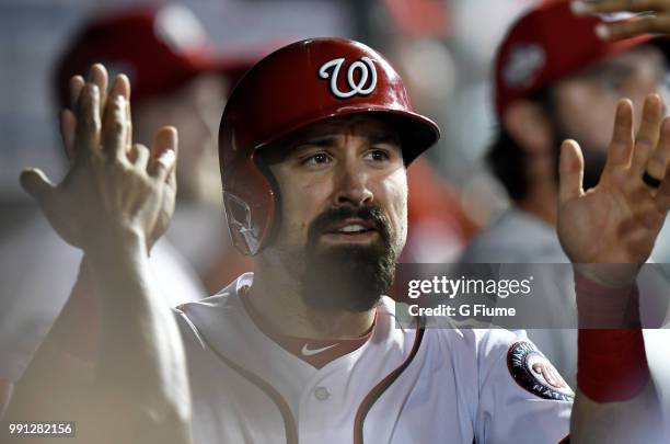 Adam Eaton of the Washington Nationals celebrates with teammates after scoring against the Philadelphia Phillies at Nationals Park on June 24, 2018...
