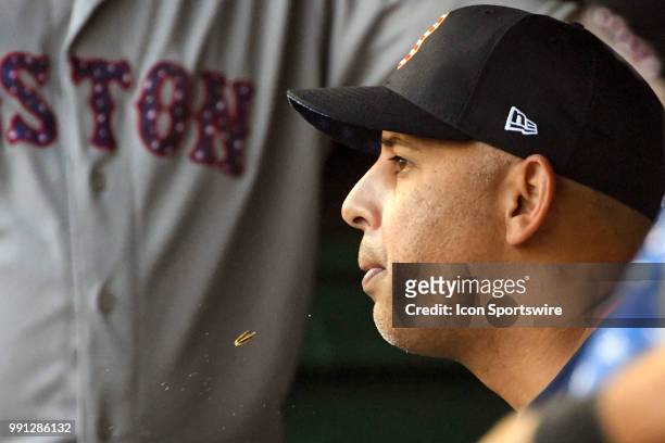Boston Red Sox manager Alex Cora spits out a sunflower seed in the dugout during the game between the Boston Red Sox and the Washington Nationals on...