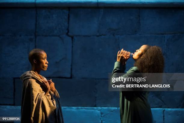 Singer Rokia Traore playing Femme de Chypre and singer Kelebogile Pearl Besong playing Dido perform in Henry Purcell's opera "Dido and Aeneas "...