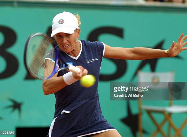 Rachel McQuillan of Australia returns in her third round match against Martina Hingis of Switzerland during the French Open Tennis at Roland Garros,...