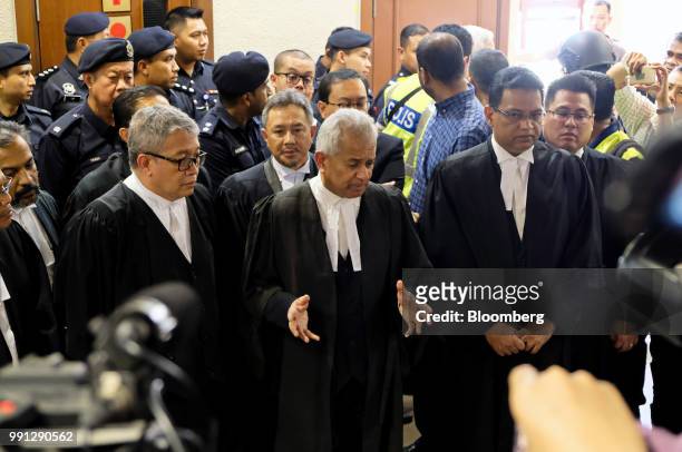 Tommy Thomas, Malaysia's attorney general, center, speaks to the members of the media during a news conference at the Kuala Lumpur Courts Complex in...