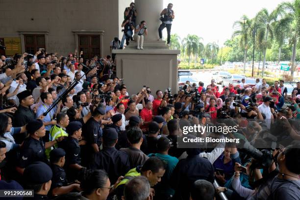 Members of the media gather outside the Kuala Lumpur Courts Complex in Kuala Lumpur, Malaysia, on Wednesday, July 4, 2018. Malaysias former...